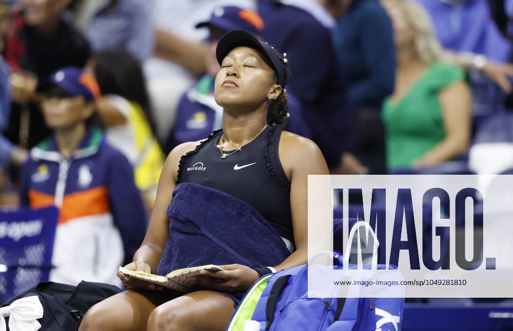 Naomi Osaka flips through pages of a journal during a changeover in her match against Karolina Muchova in the second round in Arthur Ashe Stadium of the 2024 US Open Tennis Championships in at the USTA Billie Jean King National Tennis Center on Thursday, August 29, 2024 in New York City. NYP20240829113 JOHNxANGELILLO