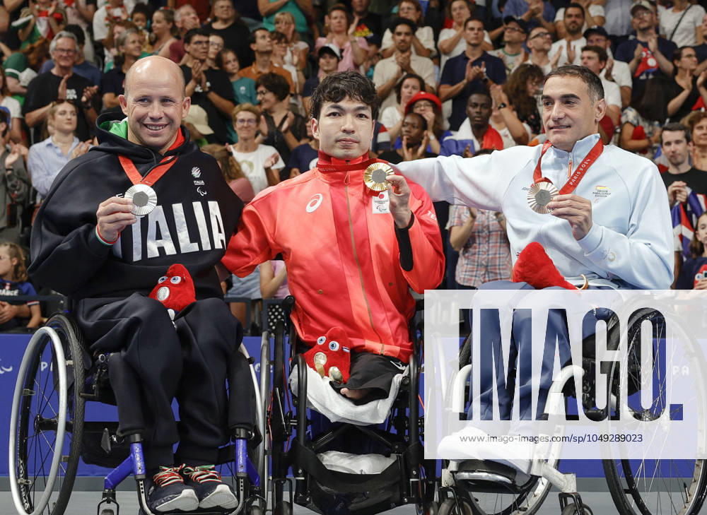 Paris Paralympics: Swimming Takayuki Suzuki (C) of Japan poses for photos with his gold medal for the men s SB3 50-meter breaststroke at the Paris Paralympics at La Defense Arena in Nanterre, near Paris, during the medal ceremony on Aug. 29, 2024, alongside silver medalist Efrem Morelli (L) of Italy and bronze medalist Miguel Luque of Spain. A14AA0003353653P