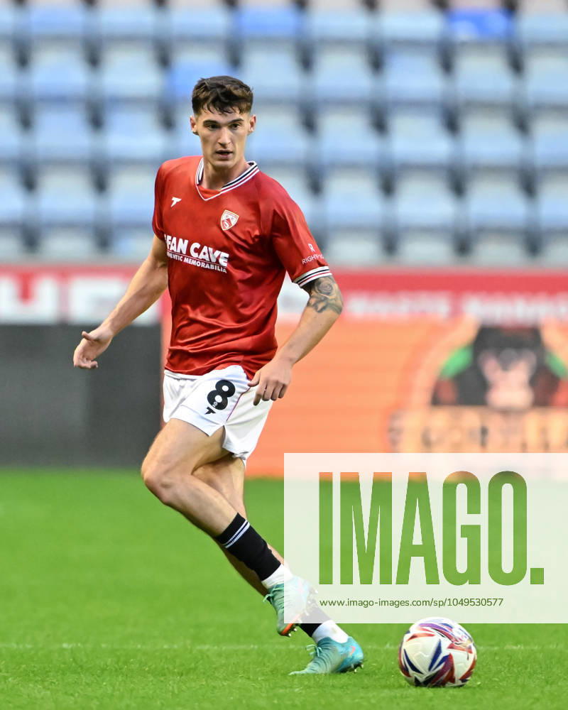 Bristol Street Motors Trophy Wigan Athletic v Morecambe Harvey Macadam of Morecambe passes the ball during the Bristol Street Motors Trophy match Wigan Athletic vs Morecambe at DW Stadium, Wigan, United Kingdom, 3rd September 2024 (Photo by Cody Froggatt News Images) Wigan DW Stadium Greater Manchester United, ManU Kingdom