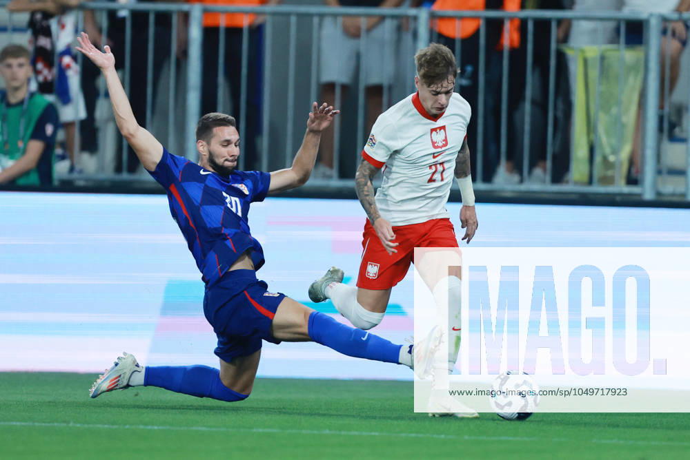 Croatia v Poland - UEFA Nations League 2024 25 League A Group A1 OSIJEK, CROATIA - SEPTEMBER 8: Player of Croatia Marko Pjaca stops player of Poland Nicola Zalewski during the UEFA Nations League 2024 25 League A Group A1 match between Croatia and Poland at on September 8, 2024 in Osijek, Croatia. DavorxJavorovicj Pixsell