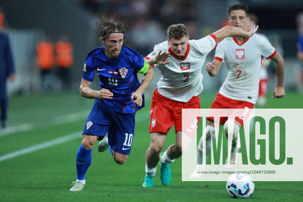 Croatia v Poland - UEFA Nations League 2024 25 League A Group A1 OSIJEK, CROATIA - SEPTEMBER 8: Player of Croatia Luka Modric and player of Poland Pawel Dawidowicz fight for a ball during the UEFA Nations League 2024 25 League A Group A1 match between Croatia and Poland at on September 8, 2024 in Osijek, Croatia. DavorxJavorovic Pixsell