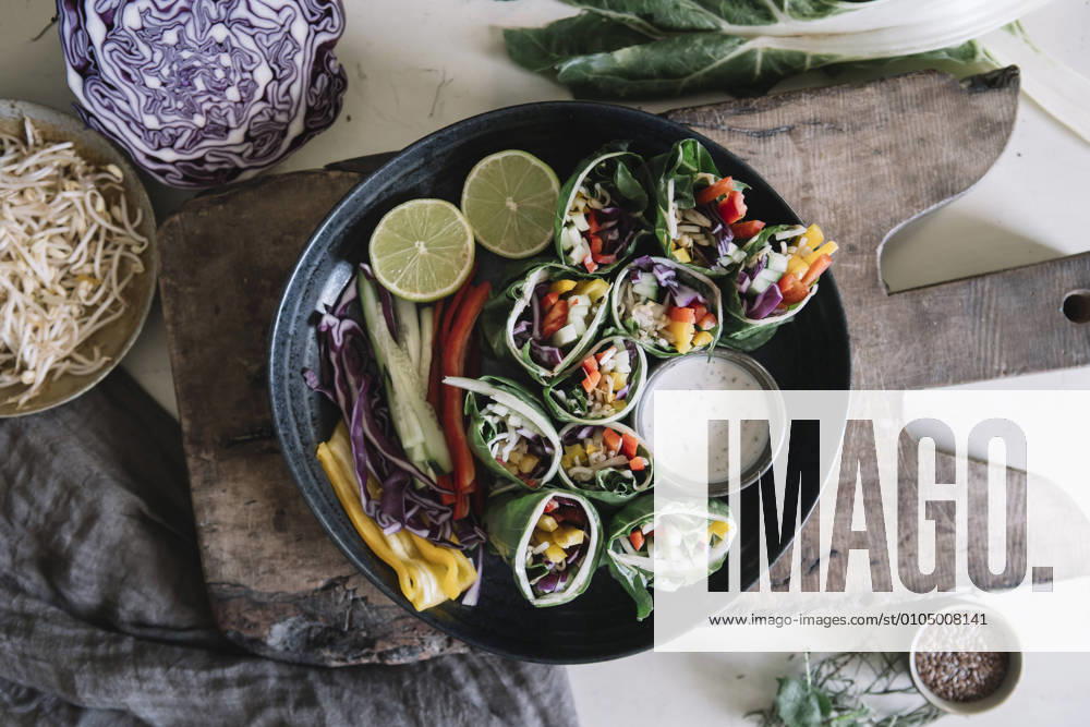 Vegan rolls with vegetables and yoghurt sauce in bowl ALBF01373