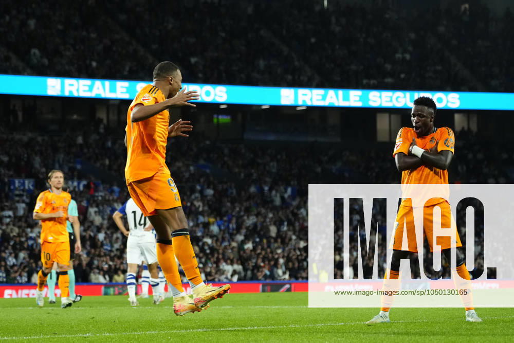 Real Sociedad v Real Madrid CF - La Liga EA Sports Kylian Mbappe centre-forward of Real Madrid and France celebrates with Vinicius Junior left winger of Real Madrid and Brazil after scoring his sides first goal during the La Liga match between Real Sociedad de Futbol and Real Madrid CF at Reale Arena on September 15, 2024 in San Sebastian, Spain. San Sebastian Basque Country Spain