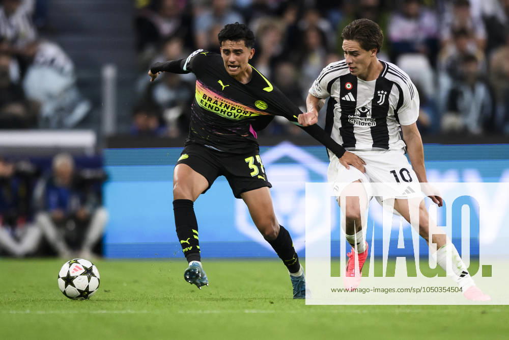 Juventus FC v PSV Eindhoven - UEFA Champions League Richard Ledezma of PSV Eindhoven competes for the ball with Kenan Yildiz of Juventus FC during the UEFA Champions League football match between Juventus FC and PSV Eindhoven. Turin Italy