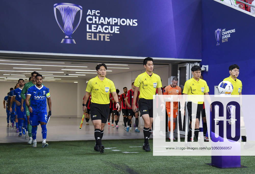 AFC CHAMPIONS LEAGUE ELITE, AL RAYYAN FC V AL-HILAL SFC Al-Hilal SFC and Al Rayyan SC players walk onto the pitch before the AFC Champions League elite west football match between Qatar s Al Rayyan SC and Saudi Arabia s Al-Hilal SFC at Ahmad Bin Ali Stadium in Al Rayyan, Qatar on September 17, 2024. DOHA Qatar