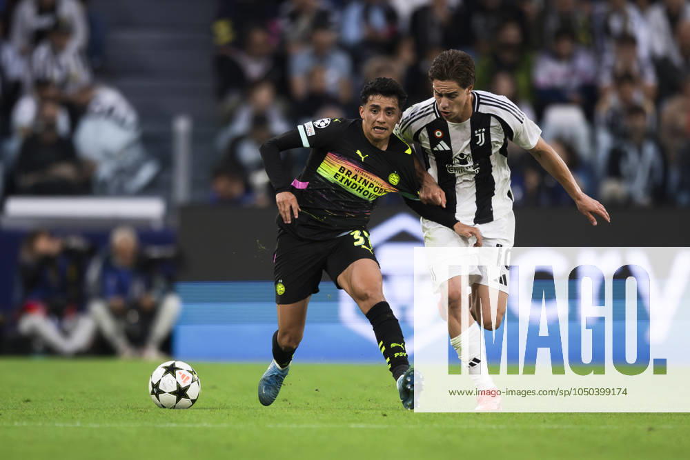 Juventus FC v PSV Eindhoven - UEFA Champions League Richard Ledezma of PSV Eindhoven competes for the ball with Kenan Yildiz of Juventus FC during the UEFA Champions League football match between Juventus FC and PSV Eindhoven. Turin Italy