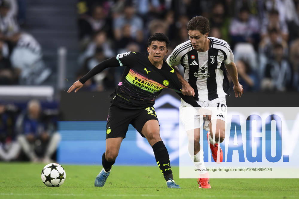 Juventus FC v PSV Eindhoven - UEFA Champions League Richard Ledezma of PSV Eindhoven competes for the ball with Kenan Yildiz of Juventus FC during the UEFA Champions League football match between Juventus FC and PSV Eindhoven. Turin Italy