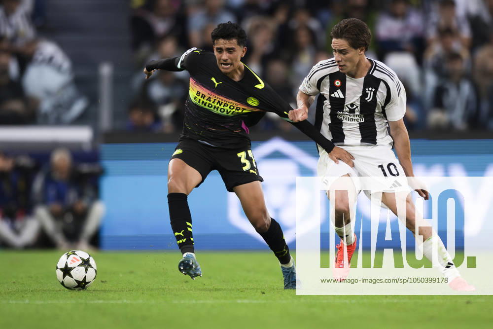Juventus FC v PSV Eindhoven - UEFA Champions League Richard Ledezma of PSV Eindhoven competes for the ball with Kenan Yildiz of Juventus FC during the UEFA Champions League football match between Juventus FC and PSV Eindhoven. Turin Italy
