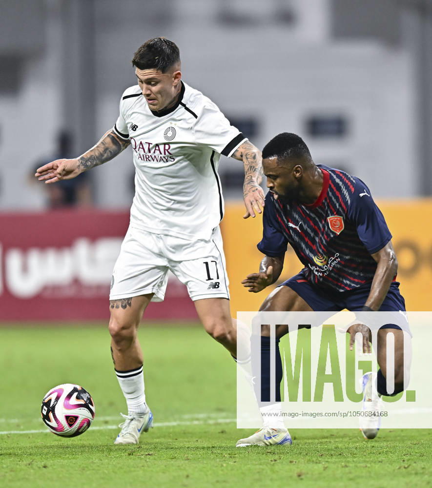 AL-SADD SC VS AL DUHAIL SC-OOREDOO STARS LEAGUE QATAR Cristo Ramon Gonzalez Perez (L) of Al-Sadd SC and Ismail Mohamad (R) of Al Duhail SC in action during the Ooredoo Qatar Stars League 24 25 match between Al-Sadd SC and Al Duhail SC at Jassim bin Hamad Stadium in Doha, Qatar, on September 21, 2024. DOHA Qatar