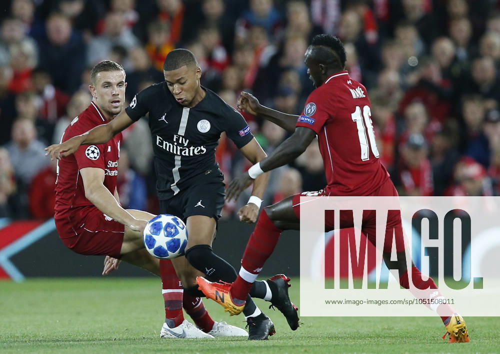 Liverpool v Paris Saint-Germain - UEFA Champions League - Group C - Anfield September 18, 2018 - Liverpool, United Kingdom - PSG forward Kylian Mbappe runs through Liverpool midfielder Jordan Henderson (l) and Liverpool midfielder Sadio Mane (r) during the UEFA Champions League - Group C match at the Anfield Stadium, Liverpool. Picture date 18th September 2018. Picture credit should read: Andrew Yates Sportimage Liverpool United Kingdom