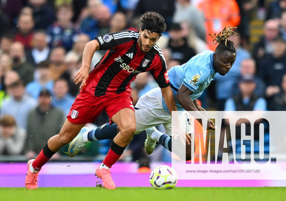 Manchester City v Fulham Premier League Raul Jimenez of Fulham and Jeremy Doku of Manchester City during the Premier League match at the Etihad Stadium, Manchester UK Newspapers OUT