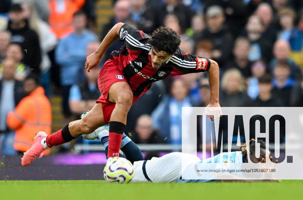 Manchester City v Fulham Premier League Raul Jimenez of Fulham and Jeremy Doku of Manchester City during the Premier League match at the Etihad Stadium, Manchester UK Newspapers OUT