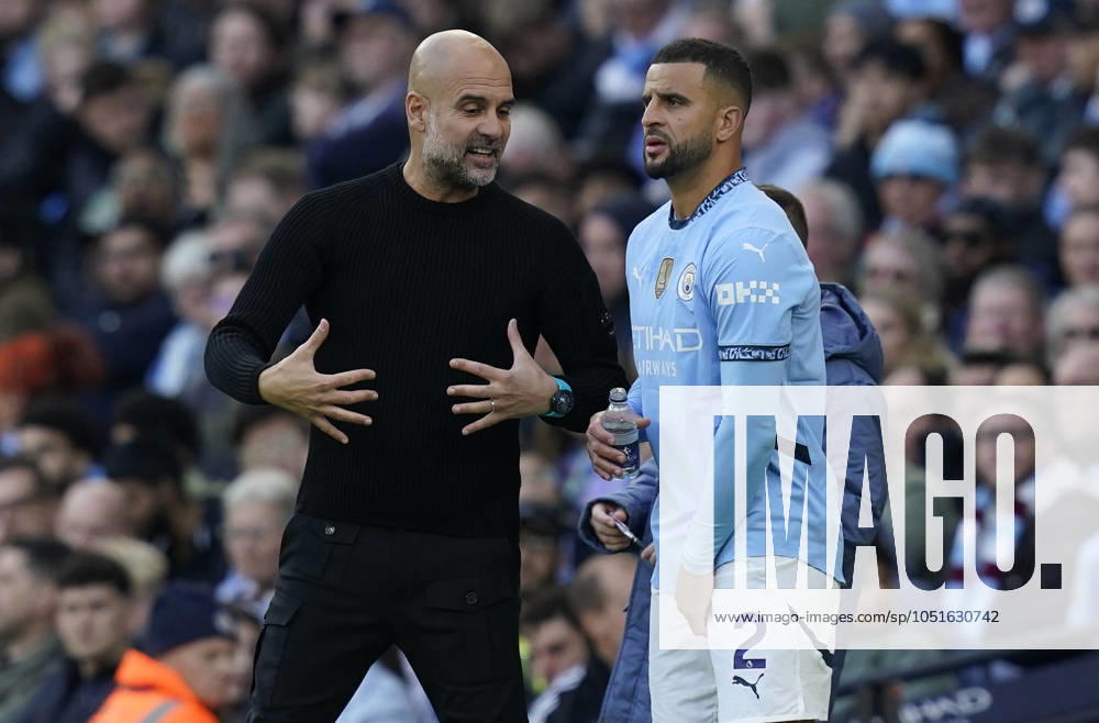 Manchester, England, 5th October 2024. Josep Guardiola coach of Manchester City (L) with Kyle Walker of Manchester City during the Premier League match at the Etihad Stadium, Manchester. Picture credit should read: Andrew Yates Sportimage . SPI-3360-0086