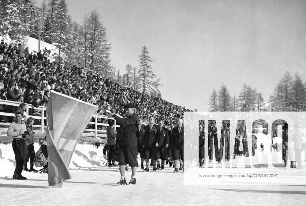 SWITZERLAND SAINT MORITZ 1948 01 30 The Swedish team marches into the Ice Stadium in St Moritz during the opening ceremony at the 1948 Winter Olympics The standard bearer is Erik Diman Lindström Sankt Moritz Switzerland OS sp sw