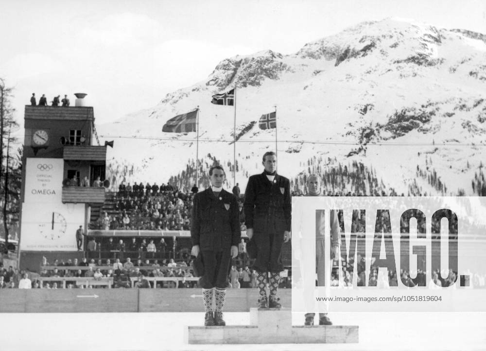 SWITZERLAND SAINT MORITZ 1948 02 Orig caption OLYMPIC WINTER GAMES ST MORITZ THE GREATEST DAY IN A SPORTSMANS LIFE The medal ceremony for the winners of the speed skating competition took place today in the St Moritz ice stadium, Gold medal and Goethe Hedlund Sweden , Bronze medal Above the stadium the banners of Norway and Sweden, on the tower the Olympic fire burning continuously during the competitions Note Skaters On the podium Trio Winners Winners Patterned knee socks CD355 persons GÖTE HEDLUND REIDAR LIAKLEV ODD LUNDBERG sites SWITZERLAND SANKT MORITZ NORWAY SWEDEN SANKT MORITZ SWITZERLAND OS sp sw