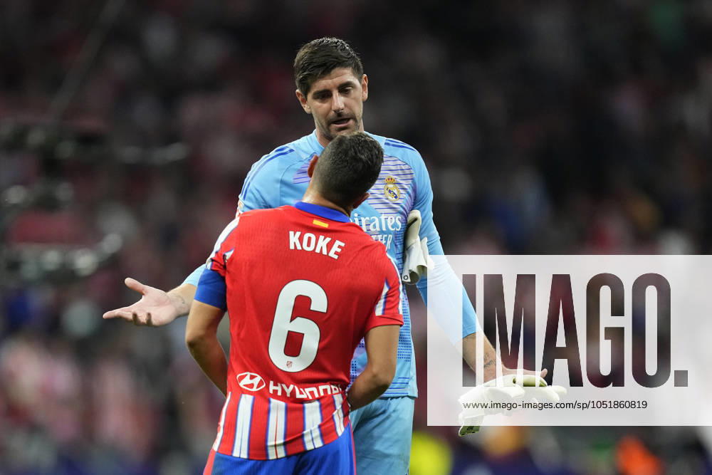 Atletico de Madrid v Real Madrid CF - La Liga EA Sports Thibaut Courtois goalkeeper of Real Madrid and Belgium and Koke Resurreccion central midfield of Atletico de Madrid and Spain talks after the LaLiga match between Atletico de Madrid and Real Madrid CF at Estadio Civitas Metropolitano on September 29, 2024 in Madrid, Spain. Madrid Spain