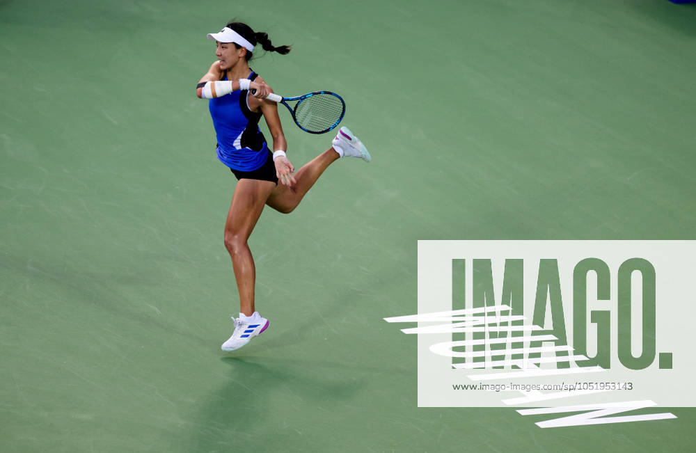 (241009) -- WUHAN, Oct. 9, 2024 -- Wang Xinyu hits a return during the women s singles round of 32 match between Wang Xinyu of China and Lucia Bronzetti of Italy at the 2024 Wuhan Open tennis tournament in Wuhan, capital of central China s Hubei Province, Oct. 9, 2024. ) (SP)CHINA-WUHAN-TENNIS-WUHAN OPEN-WOMEN S SINGLES(CN) HuxJingwen
