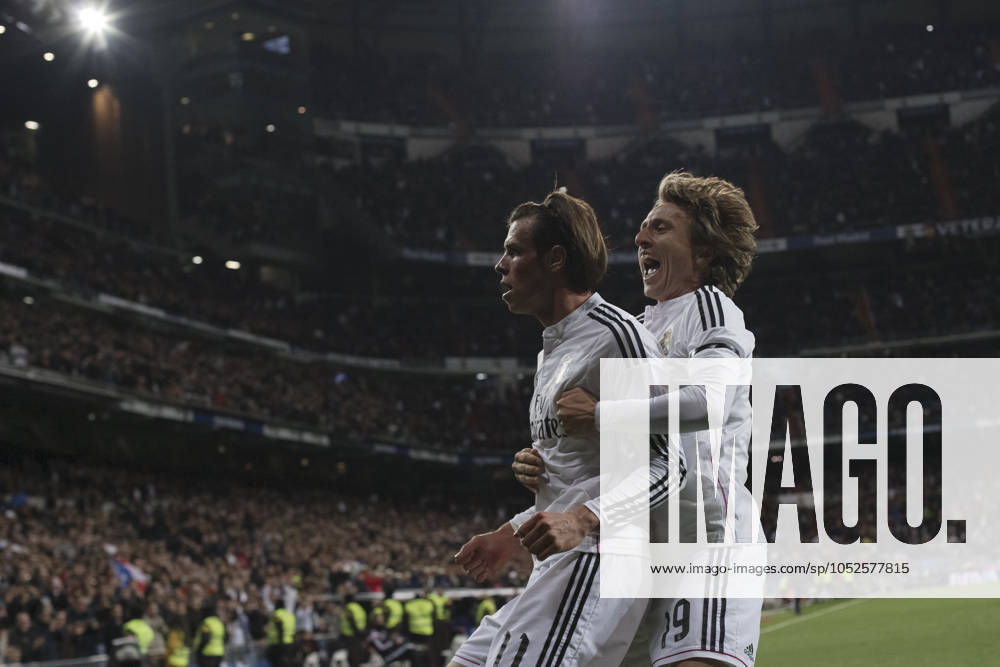 REAL MADRID vs Levante SPAIN, Madrid:Real Madrid s Welsh forward Gareth Bale and Luka Modric of Real Madrid Celebrates a goal during the Spanish League 2014 15 match between Real Madrid and Levante, at Santiago Bernabeu Stadium in Madrid on March 15, 2015. (Photo by Guillermo Martinez) Madrid Santiago BernabŽu Stadium Spain