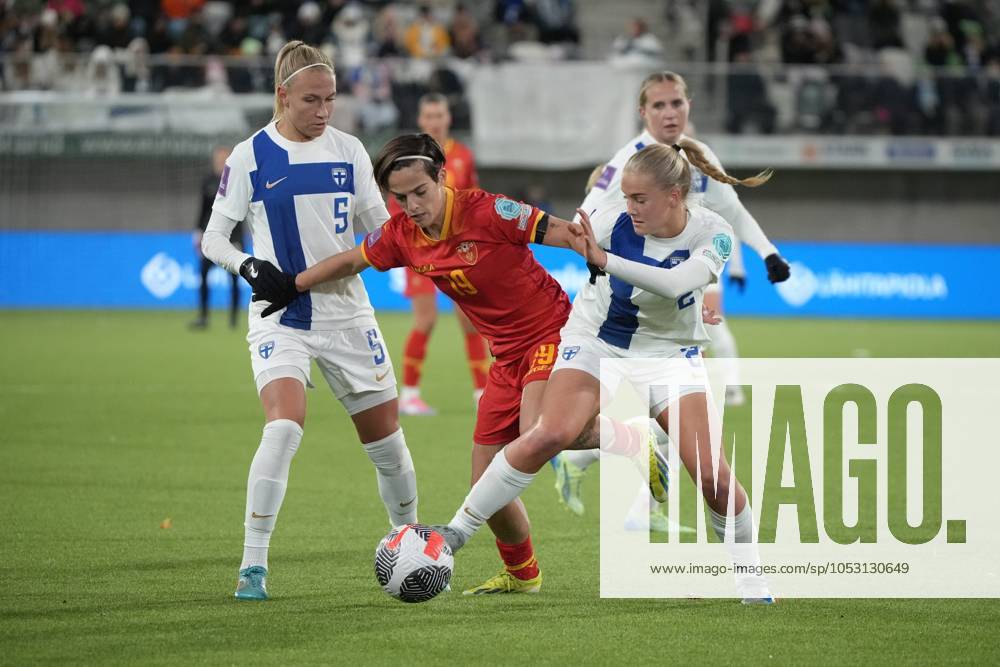 Lilli Halttunen 2 and Emma Koivisto 5 of Finland vies for the ball against Nadia Stanovic 19 of Montenergo during football UEFA Women s EURO 2025 Qualifiers Round 1 Play-off 2nd leg match Finland vs Montenegro in Tampere, Finland on October 29, 2024. Tampere Finland LKFTVX20241029194827JGRH