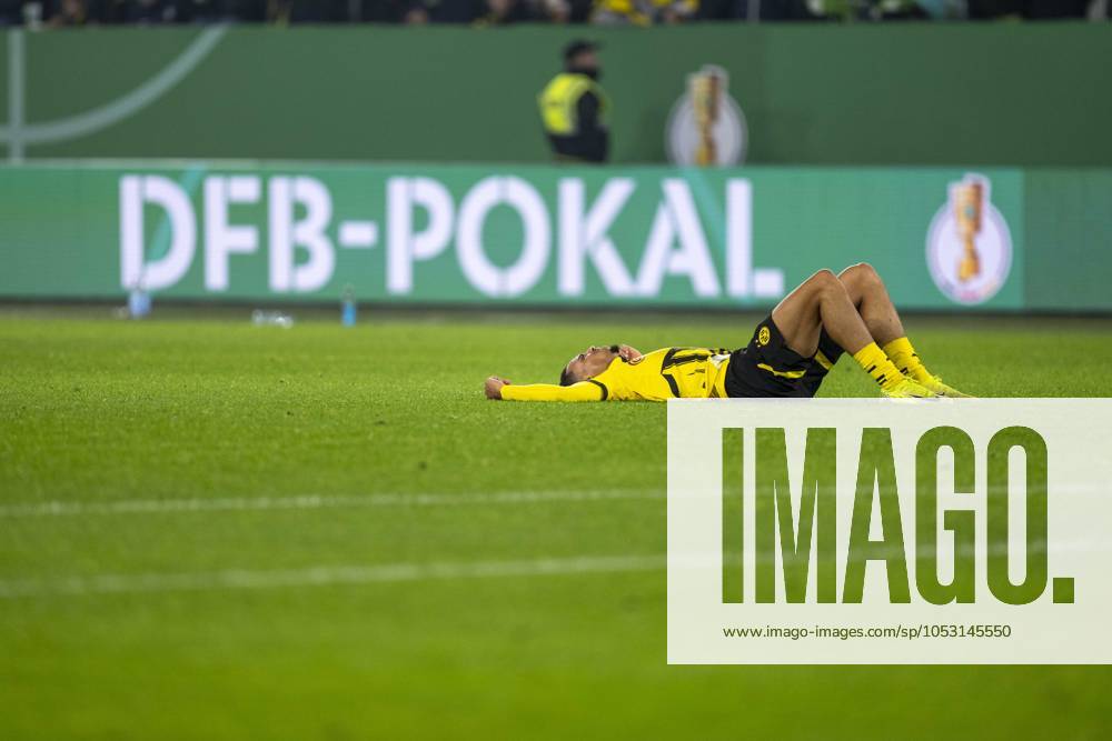 Football DFB Cup, 2nd round, VfL Wolfsburg Borussia Dortmund in the Volkswagen Arena Dortmunds Felix Nmecha lies disappointed on the pitch Important note According to the regulations of the DFL German Football League and the DFB German Football Association, it is prohibited to use or have used photographs taken in the stadium and or of the match in the form of sequential images and or video-like photo series