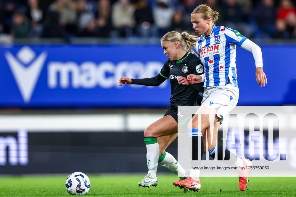 2024-11-02 sc Heerenveen v Feyenoord - Dutch Azerion Womens Eredivisie HEERENVEEN, NETHERLANDS - NOVEMBER 2: Noëlle Van Der Sluijs of Feyenoord battles for the ball with Evi Maatman of sc Heerenveen during the Dutch Azerion Womens Eredivisie match between sc Heerenveen and Feyenoord at Abe Lenstra Stadion on November 2, 2024 in Heerenveen, Netherlands. (Photo by Pieter van der Woude BSR Agency) Heerenveen Netherlands Content not available for redistribution in The Netherlands directly or indirectly through any third parties.