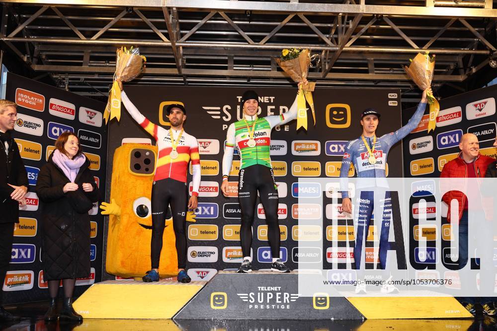 KW46 L-R, second Spanish Felipe Orts Lloret, winner Belgian Laurens Sweeck and third Belgian Niels Vandeputte celebrate on the podium of the men s elite race at the Jaarmarktcross cyclocross cycling event in Niel, race 3 8 of the Superprestige competition, Monday 11 November 2024. DAVIDxPINTENS x105184463x