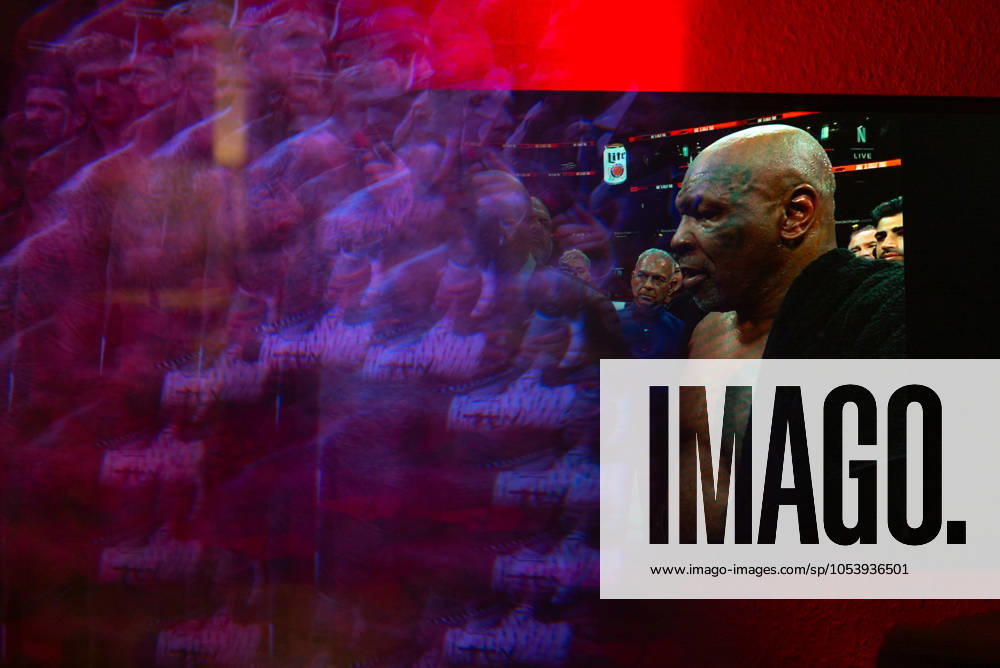 Reflections of the Paul, Tyson fight as viewed online presented by Netflix. Jake Paul wins the fight against Mike Tyson by unanimous decision after a full eight-round heavyweight match in AT&T Stadium in front of 70,000 fans on Friday. Hosted onine by Netflix with an estimated tens of millions of viewers. Manhattan USA - ZUMAt152 20241116_znp_t152_028