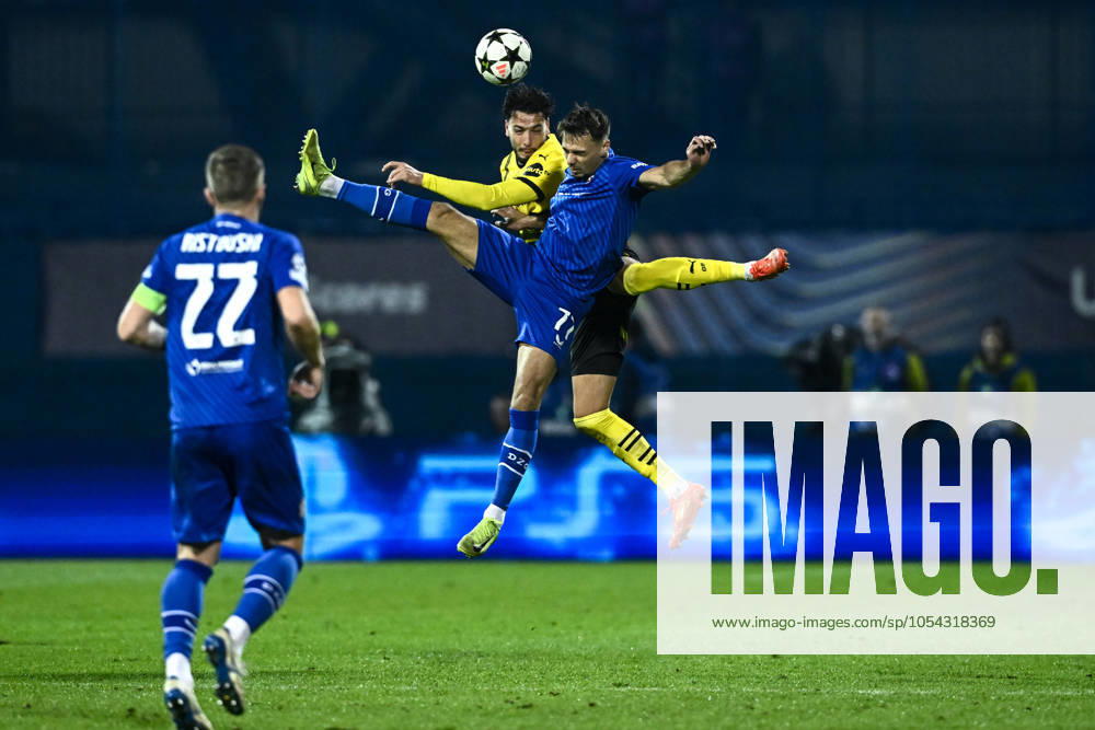 KW48 GNK Dinamo v Borussia Dortmund - UEFA Champions League 2024 25 League Phase MD5 Dario Spikic of Dinamo Zagreb and Ramy Bensebaini of Borussia Dortmund fight for a ball during the UEFA Champions League 2024 25 League Phase MD5 match between GNK Dinamo Zagreb and Borussia Dortmund at Maksimir stadium on November 27, 2024 in Zagreb, Croatia. MarkoxLukunic PIXSELL