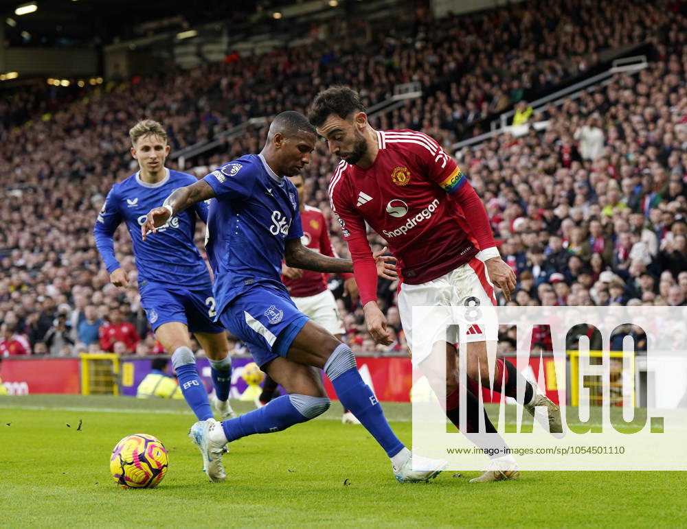 Manchester, England, 1st December 2024. Manchester United, ManU Äs Bruno Fernandes with Everton s Ashley Young with during the Premier League match at Old Trafford, Manchester. Picture credit should read: Andrew Yates Sportimage . SPI-3496-0040