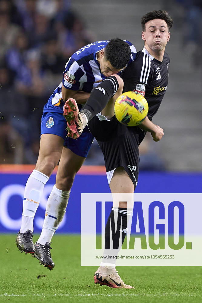 FC Porto v Casa Pia AC - Liga Portugal Betclic Nehuen Perez of FC Porto competes for the ball with Max Svensson of Casa Pia AC during the Liga Portugal Betclic match between FC Porto and Casa Pia AC at Estadio Do Dragao in Porto, Portugal, on December 2, 2024 Porto, Portugal Porto Portugal