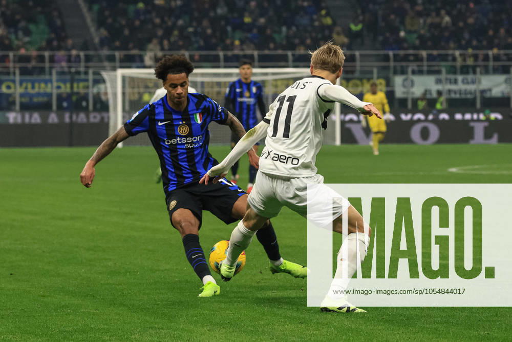 Pontus Almqvist (Parma Calcio) fights for the ball against Tajon Buchanan (FC Internazionale) during Inter - FC Internazionale vs Parma Calcio, Italian soccer Serie A match in Milan, Italy, December 06 2024
