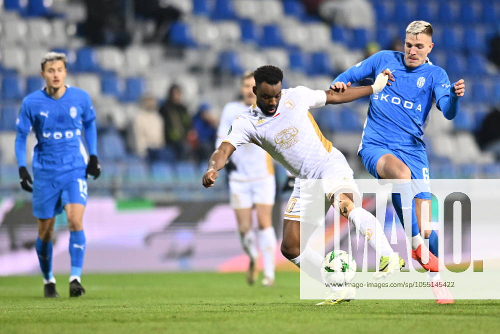 L-R Afimico Pululu (Jagiellonia) and Patrik Vydra (Boleslav) in action during the Football Conference League 5th round match: FK Mlada Boleslav vs Jagiellonia Bialystok in Mlada Boleslav, Czech Republic, December 12, 2024. (CTKxPhoto RadekxPetrasek) CTKPhotoP2024121208761 CTKPhotoP2024121208761