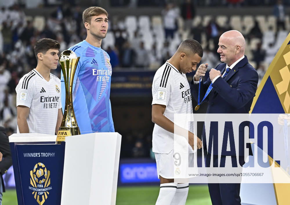 (241219) -- LUSAIL, Dec. 19, 2024 -- FIFA President Gianni Infantino (1st R) awards Kylian Mbappe (2nd R) of Real Madrid with the gold medal during the podium ceremony after the FIFA Intercontinental Cup Qatar 2024 Final match between Spain s Real Madrid and Mexico s CF Pachuca at Lusail Stadium in Lusail, Qatar, on Dec. 18, 2024. (Photo by Xinhua) (SP)QATAR-LUSAIL-FIFA INTERCONTINENTAL CUP-FINAL-REAL MADRID VS PACHUACA Nikku