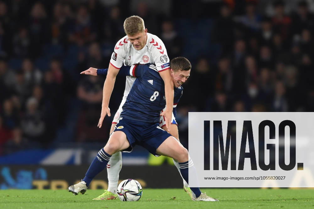 Scotland v Denmark - FIFA World Cup, WM, Weltmeisterschaft, Fussball qualifying - European - Hampden Park November 15, 2021, Glasgow, United Kingdom: Glasgow, Scotland, 15th November 2021. Andreas Cornelius of Denmark and Callum McGregor of Scotland during the FIFA World Cup qualifiers match at Hampden Park, Glasgow. Picture credit should read: Neil Hanna Sportimage Glasgow United Kingdom