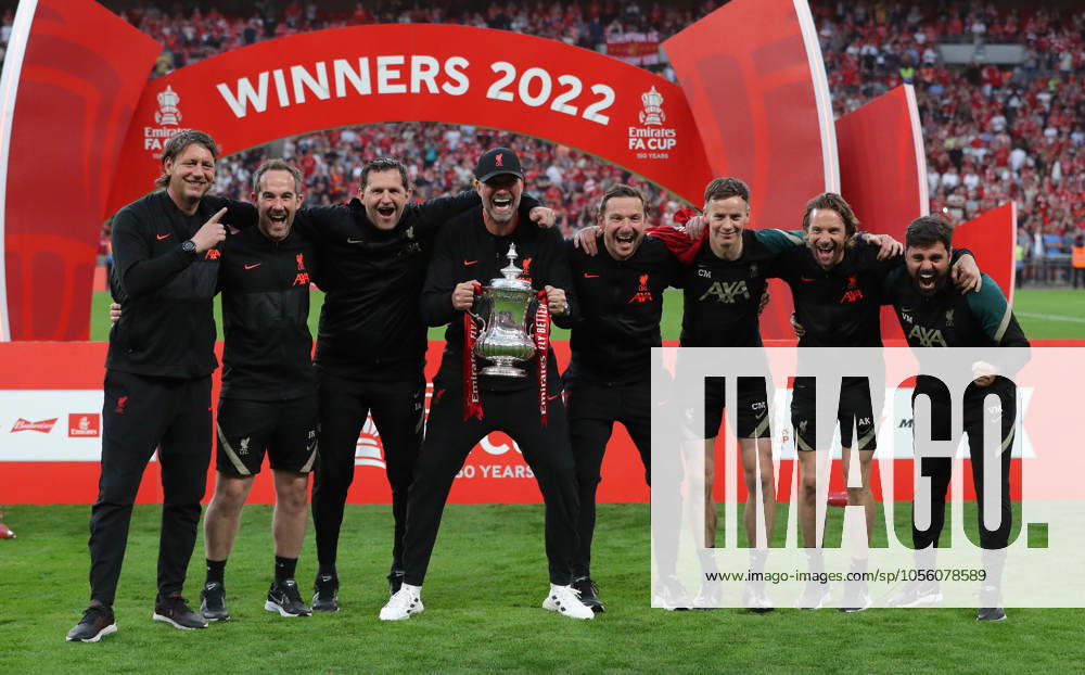Chelsea v Liverpool - Emirates FA Cup - Final - Wembley Stadium May 14, 2022, London, United Kingdom: London, England, 14th May 2022. Jurgen Klopp, Manager of Liverpool with his coaching staff with the FA Cup after their team win the Emirates FA Cup match at Wembley Stadium, London. London United Kingdom