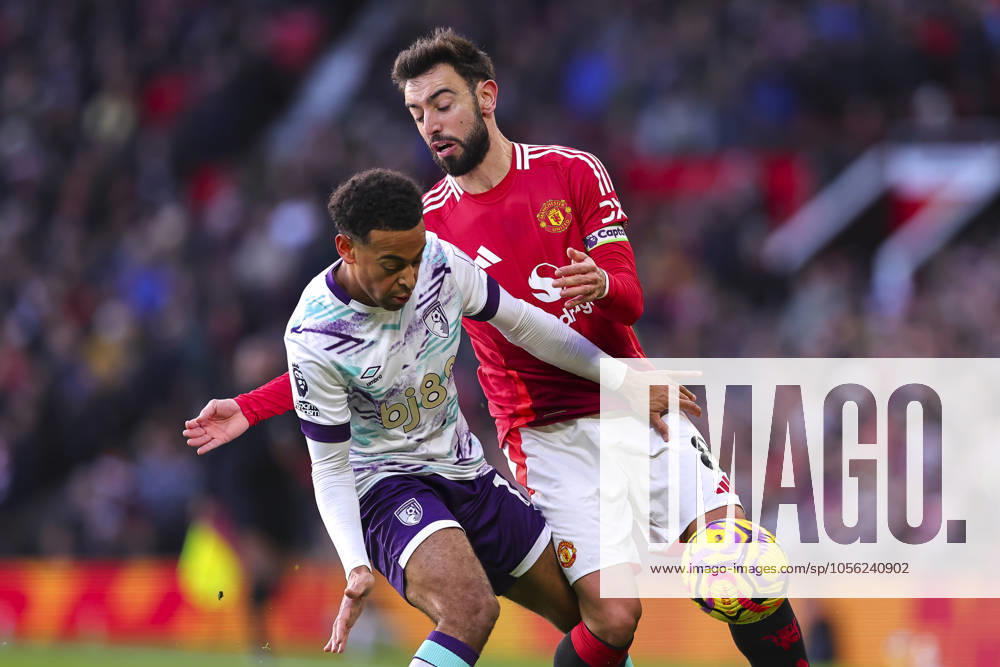 Manchester United, ManU FC v AFC Bournemouth Tyler Adams of Bournemouth and Bruno Fernandes of Manchester United battle for possession during the Manchester United FC v AFC Bournemouth English Premier League match at Old Trafford, Manchester, England, United Kingdom on 22 December 2024 Editorial use only. All images are copyright Every Second Media Limited. No images may be reproduced without prior permission. All rights reserved. Premier League and Football League images are subject to licensing agreements with Football DataCo Limited. see https: www.football-dataco.com