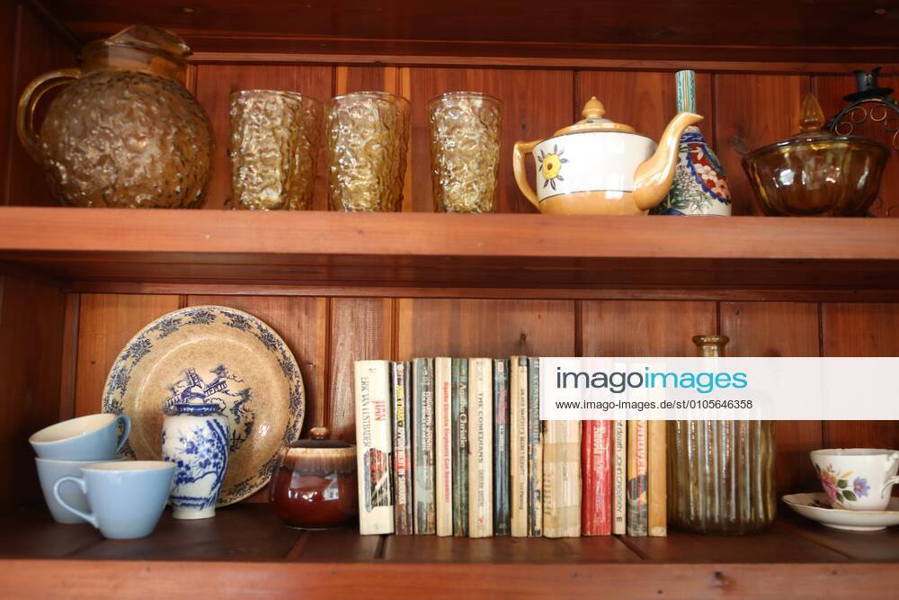 Various books, china, glasses and pottery from the 1960 s can be seen on a shelf in the former home of the late author Jack Kerouac, Thursday, October 15, 2020 at 5169 10th Ave. N. St. Petersburg. The ranch style home, built in 1963, includes 3 bedrooms, 3 baths, and is 1750 square feet. The home is owned and was renovated by Paige and Frank Viggiano, St. Petersburg, who own The Flip Side LLC, It is for sale at $350.000 St. Petersburg USA - ZUMAs70_ 20201015_zan_s70_039