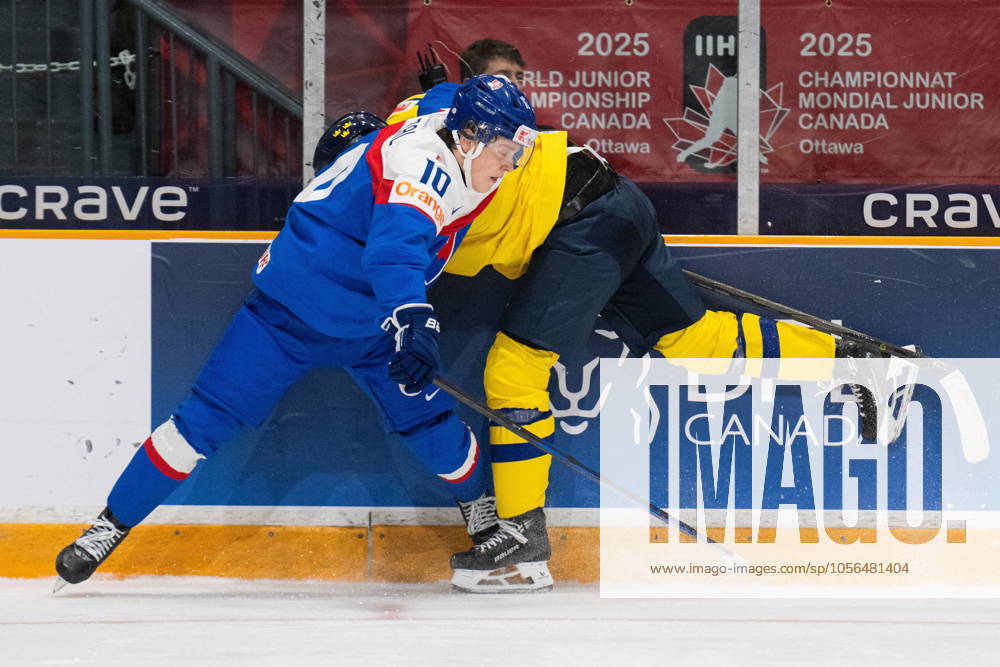 Slovakia s Tomas Pobezal (10) checks Sweden defenceman Theo Lindstein (9) into the boards during second period IIHF World Junior Hockey Championship preliminary round action in Ottawa, Thursday, Dec. 26, 2024. Canada News - December 26, 2024 - ZUMAc35_ 20241226_zaf_c35_021