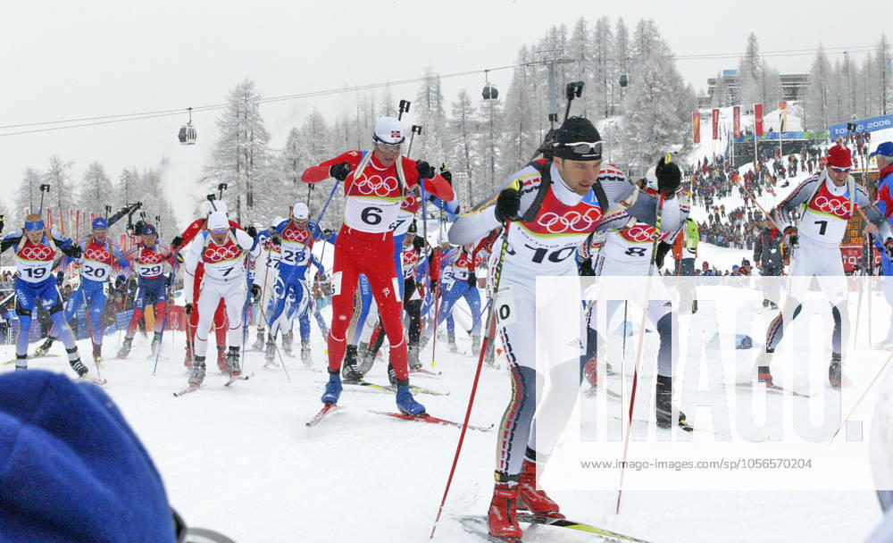 Alexander Wolf of Germany, 10, skis with the rest of the competitors in the men s 15 KM mass start biathlon competition at Cesana San Sicario, Italy Saturday February 25, 2006. Gold medal winner Michael Greis of Germany is at right. (Ron Jenkins Fort Worth Star-Telegram KRT) CESANA SAN SICARIO ITA