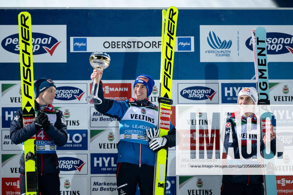 KRAFT Stefan Oesterreich celebrates his victory on the podium at the award ceremony, next to him HOERL Jan Oesterreich , TSCHOFENIG Daniel Oesterreich , GER, FIS Viessmann Ski Jumping World Cup, Four Hills Tournament opening competition Oberstdorf, Individual ski jumping competition, 2024 2025 season, 29 12 2024 GER, FIS Viessmann Ski Jumping World Cup, Four Hills Tournament opening competition Oberstdorf, Individual ski jumping competition, 2024 2025 season, 29 12 2024 Oberstdorf