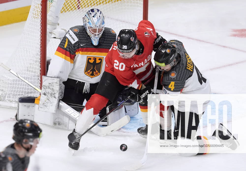 Canada forward Ethan Gauthier tries to deflect the puck past Germany goaltender Nico Pertuch as he is pressured by defenceman Max Hense during second period IIHF World Junior Hockey Championship tournament action in Ottawa, Sunday, Dec. 29, 2024. Ethan Gauthier Nico Pertuch Max Hense - ZUMAc35_ 20241229_zaf_c35_087