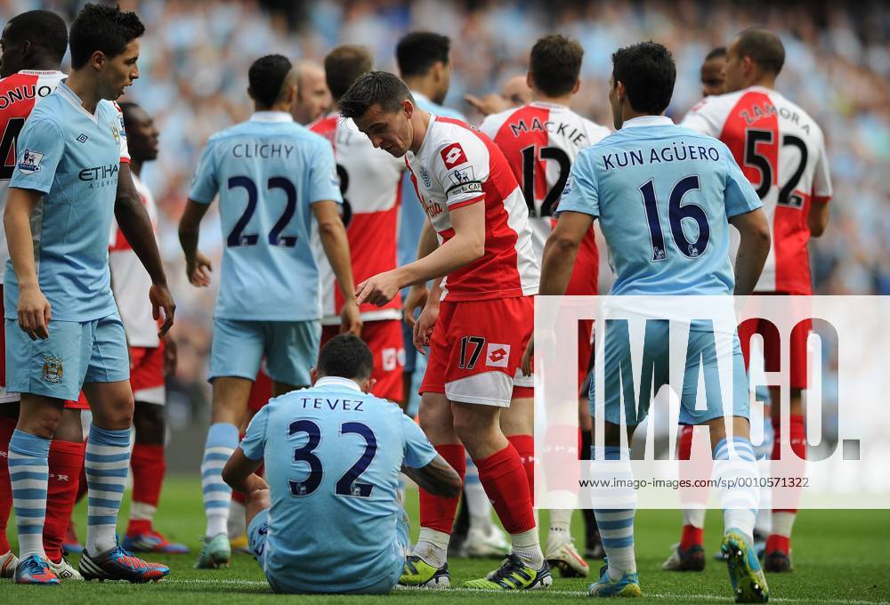 Football - Premier League - Manchester City vs. Queens Park Rangers (QPR);; Joey Barton of Queens Park Rangers points at Manchester City s Carlos Tevez following the foul that earns Barton a straight red card at the Etihad Stadium, Manchester