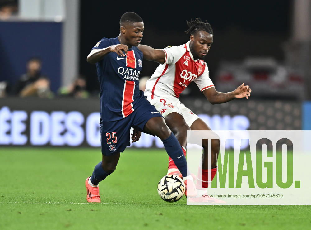 French Super Cup (Trophee des Champions) - Paris Saint-Germain vs AS Monaco Nuno Mendes (L) of Paris Saint-Germain and George Ilenikhena of AS Monacoin action during the French Super Cup (Trophee des Champions) football final match between Paris Saint-Germain (PSG) and AS Monaco at the 974 stadium in Doha, Qatar on January 5, 2025. DOHA Qatar