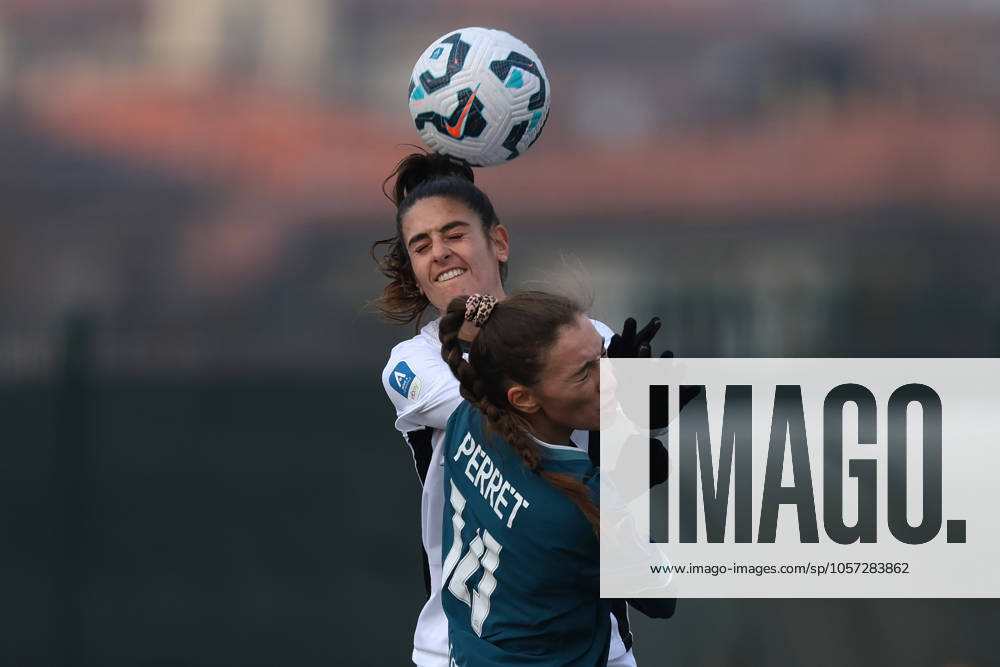 Cislago, Italy, 4th January 2025. Miriam Picchi of FC Como Women heads on from Jenny Perret of Olympique De Marseille during the Friendly match at Village, Cislago. Picture credit should read: Jonathan Moscrop Sportimage . SPI_017_JM_COMO_MARSEILLE_FEMM SPI-3569-0017