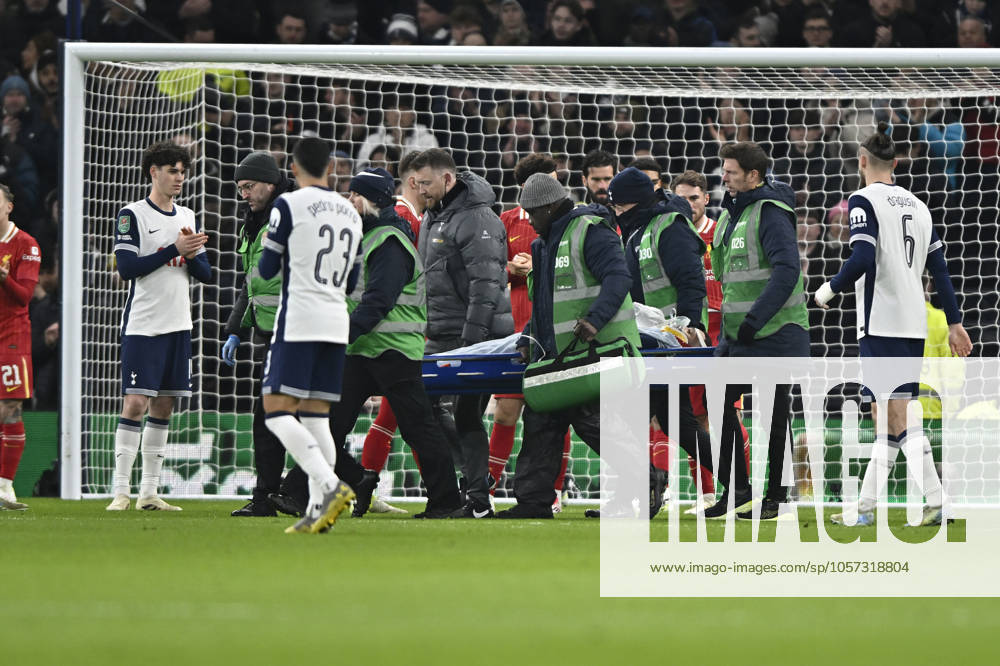 Spurs vs Liverpool Carabao Cup Rodrigo Bentancur of Tottenham Hotspur is stretchered off injured during the Spurs vs Liverpool, Carabao Cup Semi-Final first leg tie at the Tottenham Hotspur Stadium London. London Tottenham Hotspur Stadium UK