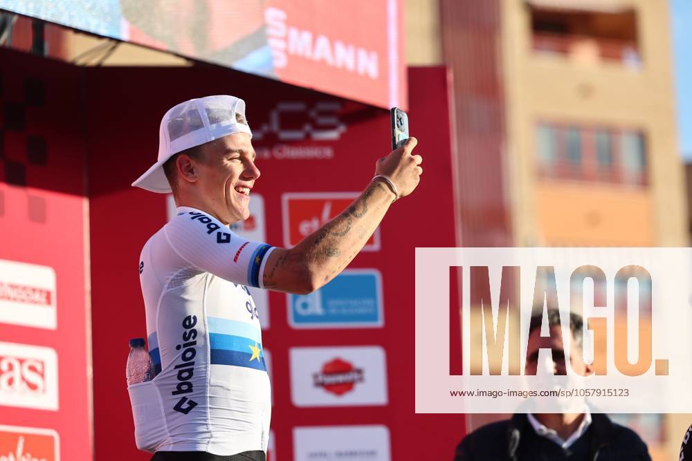 Winner Belgian Thibau Nys using his smartphone on the podium after winning the men s elite race at the cyclocross cycling event in Benidorm, Spain, Sunday 19 January 2025, stage 12 14 in the UCI World Cup competition. DAVIDxPINTENS x110725593x