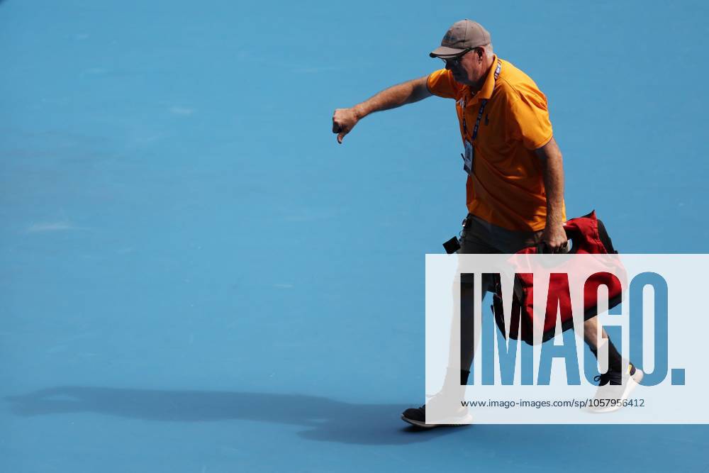 A handyman leaves the court after fixing the broken net during the fourth round match between Rune and Sinner Australian Open, Day Nine, Tennis, Melbourne Park, Melbourne, Australia - 20 Jan 2025