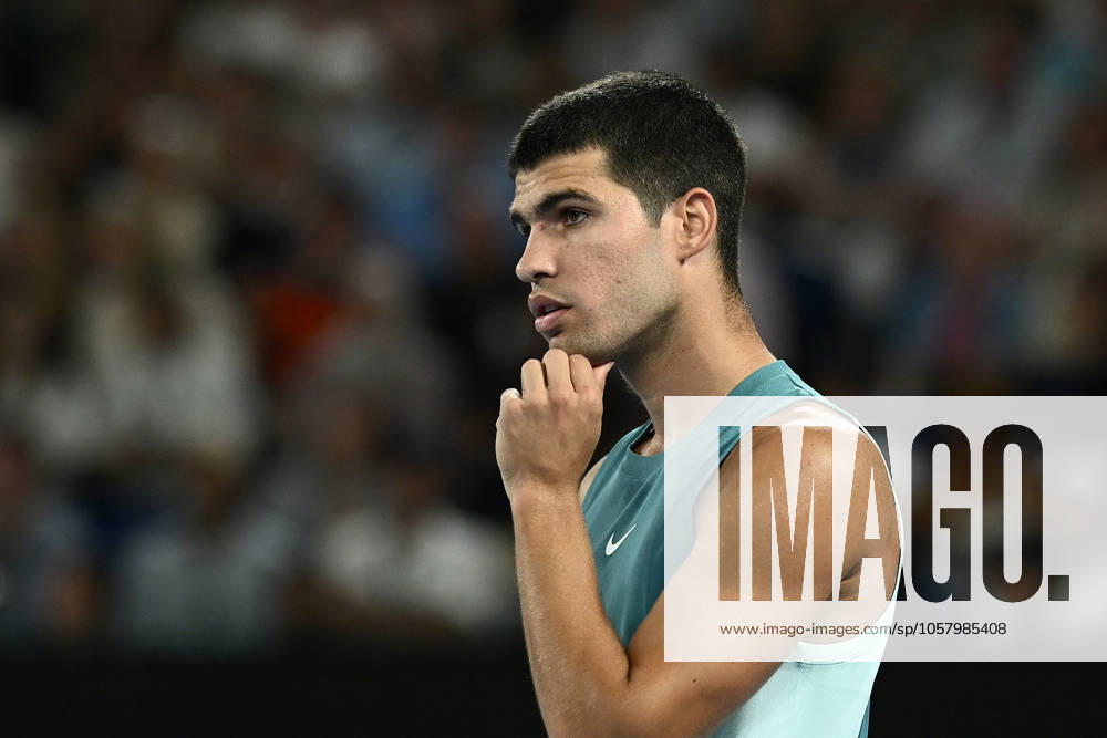 TENNIS AUSTRALIAN OPEN, Carlos Alcaraz of Spain reacts during his 1 4 final match against Novak Djokovic of Serbia during the 2025 Australian Open at Melbourne Park in Melbourne, Tuesday, January 21, 2025. ( NO ARCHIVING, , NO USE IN BOOKS WITHOUT CONSENT MELBOURNE VICTORIA AUSTRALIA