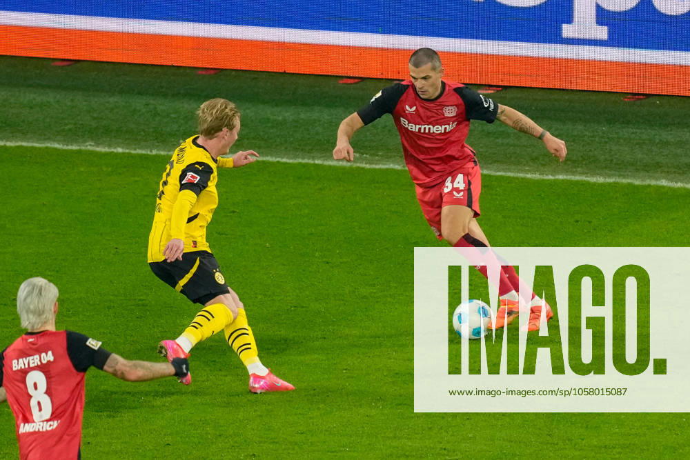 Julian Brandt Borussia Dortmund and Granit Xhaka Bayer 04 Leverkusen battle for the ball during the Bundesliga match between Borussia Dortmund and Bayer 04 Leverkusen, SIGNAL IDUNA PARK on January 10, 2025 in Dortmund, Germany, Germany Photo by Alex Gottschalk DeFodi Images Julian Brandt Borussia Dortmund and Granit Xhaka Bayer 04 Leverkusen battle for the ball during the Bundesliga match between Borussia Dortmund and Bayer 04 Leverkusen at Signal Iduna Park on January 10, 2025 in Dortmund, Germany Photo by Alex Gottschalk DeFodi Images DFL regulations prohibit any use of photographs as image sequences and or quasi video Defodi 001 ar20250110 1329625 Defodi-001 DFL regulations prohibit any use of photographs as image sequences and or quasi-video.