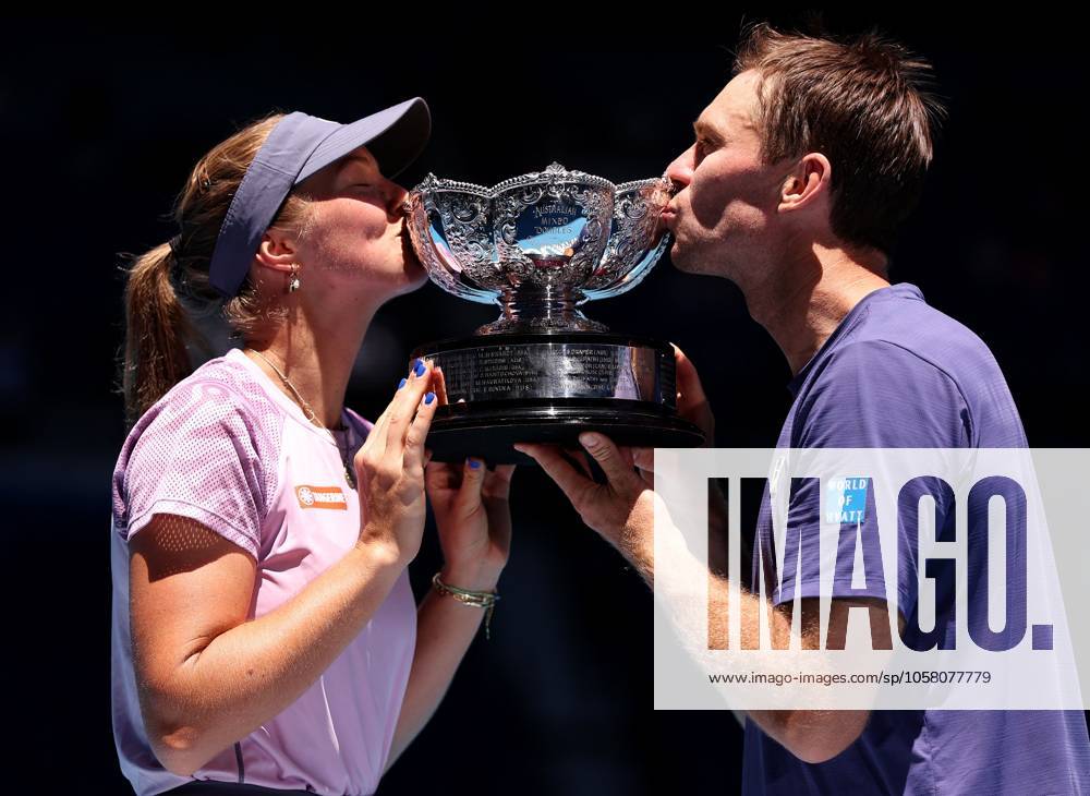 Olivia Gadecki and John Peers of Australia kiss the mixed doubles trophy Australian Open, Day Thirteen, Tennis, Melbourne Park, Melbourne, Australia - 24 Jan 2025